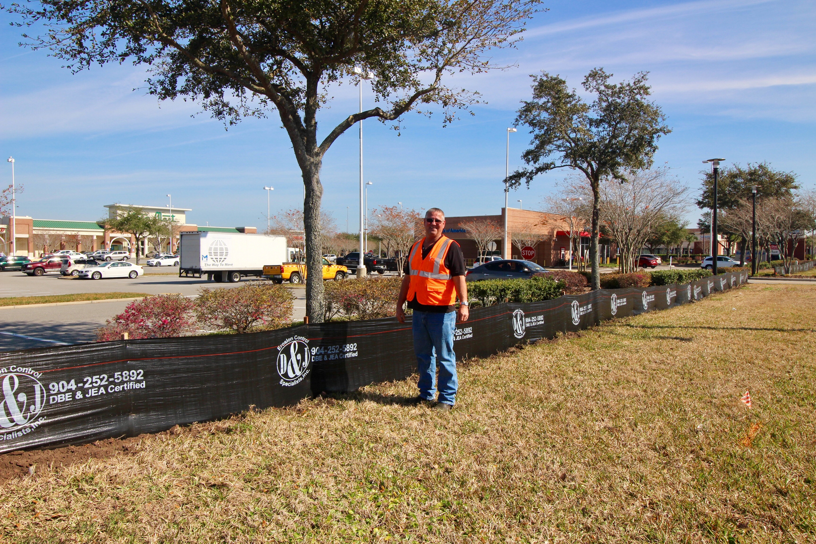 Silt fencing installed along a retail construction site